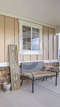 Vertical House exterior with porch and glass paned wooden front door