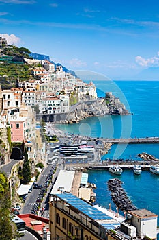 Vertical image of Amalfi with comfortable beaches and azure sea in Campania, Italy