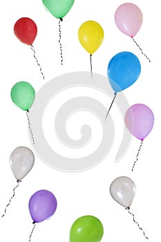 Vertical image of Balloons of different colours flying on white background with copy text in the middle