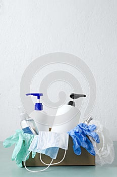 Vertical image.Basic kit of medical personal quipment, hand sanitizer,liquid soap in the box