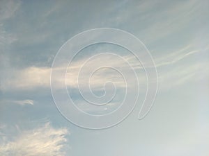 Vertical image of blue sky and white clouds on daytime.