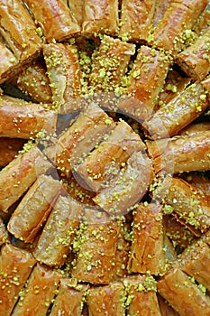 Delectable Baklava Pastries Topped with Chopped Pistachio Nuts