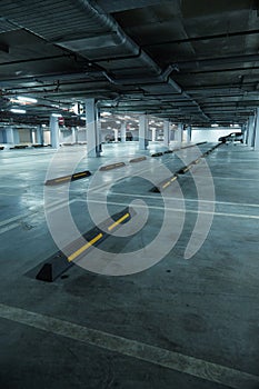 Vertical image of empty underground parking lot
