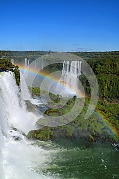 Vertical Image of a Fantastic Rainbow over the Powerful Brazillian Side Iguazu Falls, Foz do Iguacu, Brazil, South America
