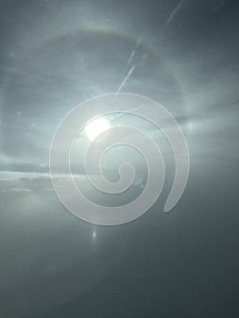 Vertical image of a halo around the sun seen from the sky photo