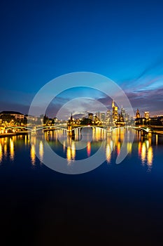 Vertical image of illuminated Frankfurt skyline at night