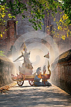 Vertical image of Khon or traditional Thai classic masked from the Ramakien as character of human dance on traditional chariot in