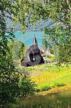 Vertical image of Ornes stave church on fjords