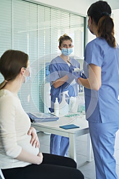 Vertical image of pregnant woman during the vaccination procedure photo