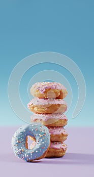 Vertical image of stack of donuts with pink and blue frosting on pink and blue background