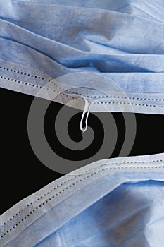 Three ply structure,single use hygenic,surgical,face mask with deformable wire isolated on black background. photo