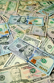 Vertical image of uncountable United States dollar banknotes