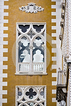 Vertical: Intricate art and sculptures adorn the historic buildings in Venice, Italy.