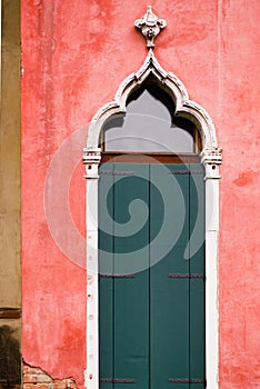 Vertical: Intricate art and sculptures adorn the historic buildings in Venice, Italy.