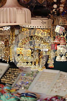 Vertical of jewelry display in an Indian market, hung on strings - concept of accessories