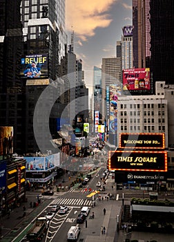 Vertical landscape of electronic billboards welcoming people to Times Square New York City