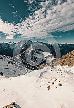 Vertical landscape view of snowy Hohes Brett, Berchtesgaden Alps with sky background, Germany