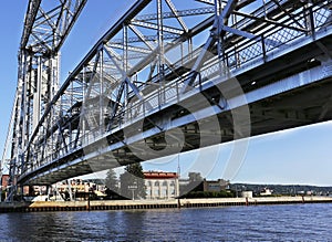 Vertical lift bridge spanning a harbor channel