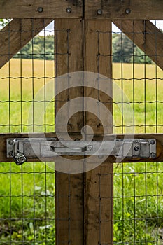 Vertical of locked fence by field