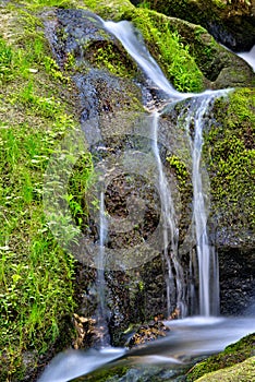 Vertical long exposure shot of the Lohnbachfall in Austria