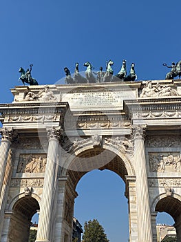 Vertical low angle shot of the Arco Della Pace on a sunny day in Milan, Italy