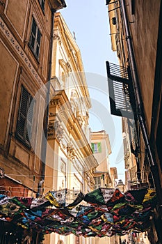 Vertical low angle shot of the beautiful alley and buildings captured in Nice, French Riviera