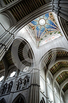 Vertical low angle shot of the beautiful ceiling in Catedral De La Almudena, Madrid, Spain photo