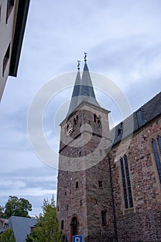 Vertical low angle shot of a building made of bricks during a gloomy weather