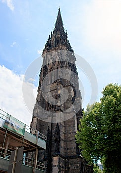 Vertical low angle shot of the Gothic revival church of st. Nicolas in Hamburg