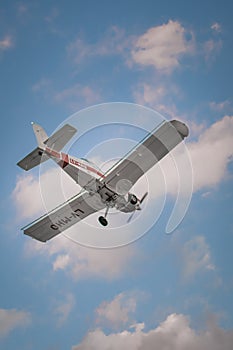 Vertical low angle shot of a light aircraft