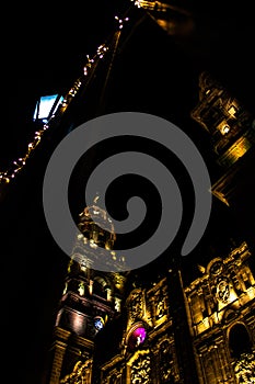 Vertical low angle shot of the lit Morelia cathedral at night