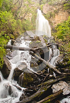 Vertical low angle shot of a majestic waterfall