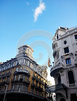 Vertical low angle shot of Maqueta Gran VÃÂ­a in Spain under a blue sky photo
