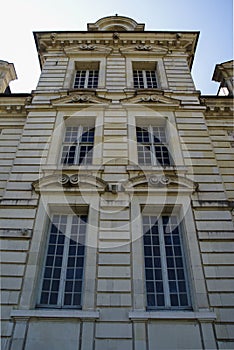 Vertical low angle shot of a part of the facade of Cheverny castle in France