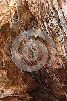 Vertical low angle shot of the patterns on the weathered stones of the mountains