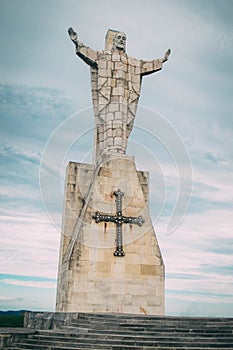 Vertical low angle shot of Sagrado Corazon Constante Monument in Spain photo
