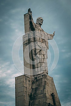Vertical low angle shot of Sagrado Corazon Constante Monument in Spain photo