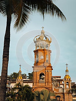 Vertical low angle view of our Lady of Guadalupe church in Puerto Vallarta, Mexico at sunset