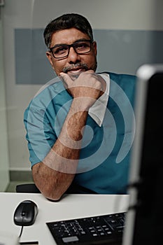 Mature Professional Radiographer At Workplace photo