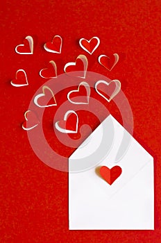 Vertical message in an envelope with a declaration of love, in feelings Valentine`s Day. letter with hearts