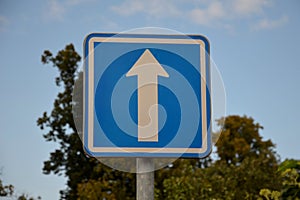 Vertical metal repair signs commanded direction of travel, one way, no entry, pedestrian zone, respirator mask dead end street in