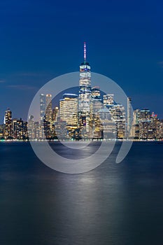 Vertical of the New York City skyline at night Lights, Midtown Manhattan.