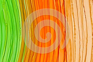 Vertical orange and green brush waves alcohol ink texture background. Multicolor smears, creative color mix, vertical lines.