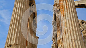 Vertical pan shot of Zeus Temple columns crowned with sophisticated capitals