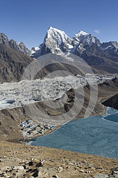 A vertical panorama of Cholatse and Taboche - two 6000m++ peaks, Ngozumpa glacier, the lodges of Gokyo and the biggest lake of Gok