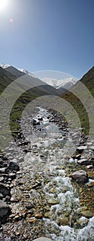 Vertical panorama of the river in the mountains of Kyrgyzstan in