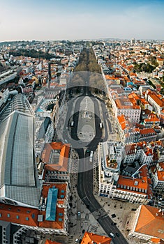 Vertical panoramic aerial view of Rossio Train Station, Restauradores Square and Avenida da Liberdade in Baixa District, Lisbon,