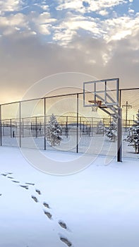 Vertical Panoramic view of a park and mountain covered with snow on a cloudy winter day