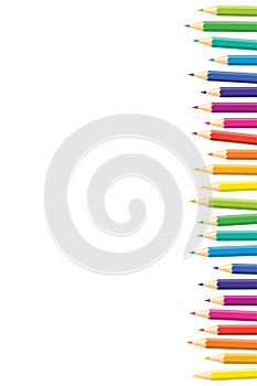 Vertical pattern Colored pencils arranged in a row with copy space for note, text, on white background. Rainbow colors. Bright