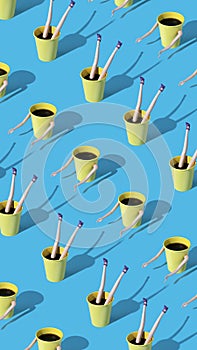 Vertical pattern made of coffee cups with female doll hands and legs on blue background